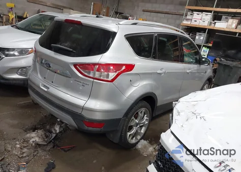2016 Ford Escape Titanium z USA, uszkodzony, nr VIN 1FMCU9J97GUC36498